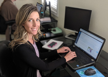 Heather, our content writer, working at her laptop.